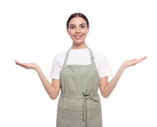 Photo of Young woman in light green apron on white background