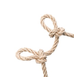 Photo of Hemp rope with knots isolated on white, top view