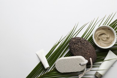 Photo of Flat lay composition with pumice stones on light background. Space for text