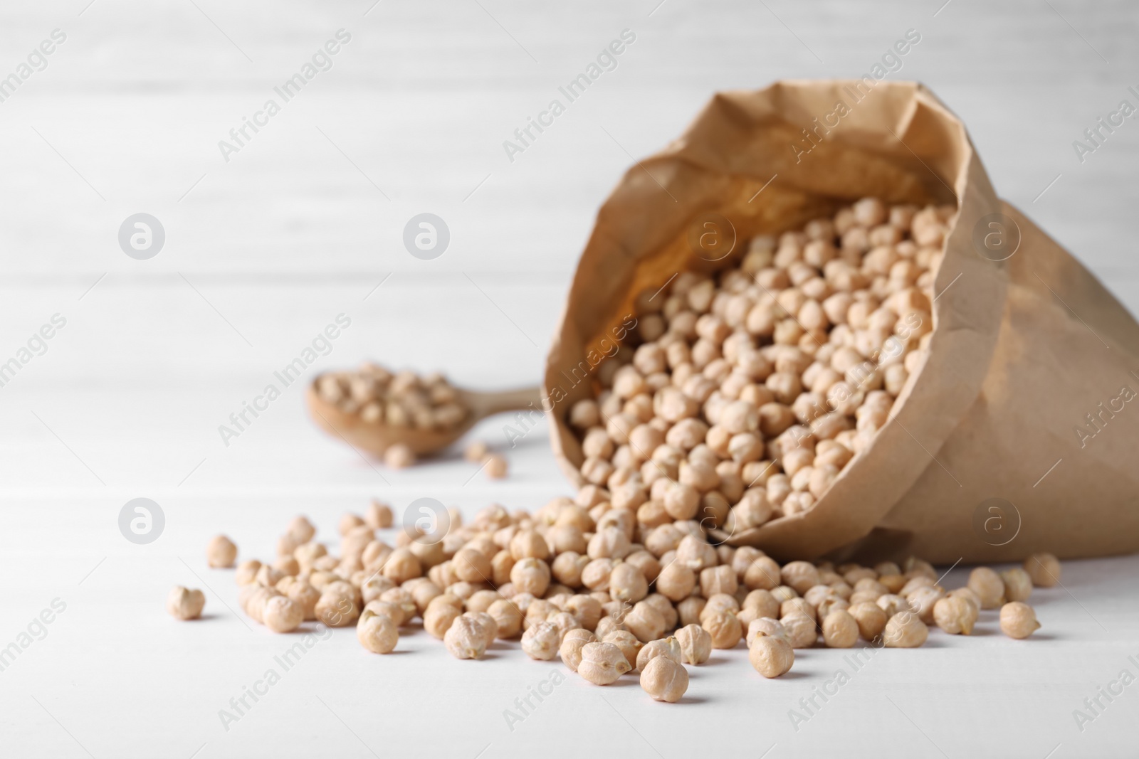 Photo of Chickpeas on white table, space for text