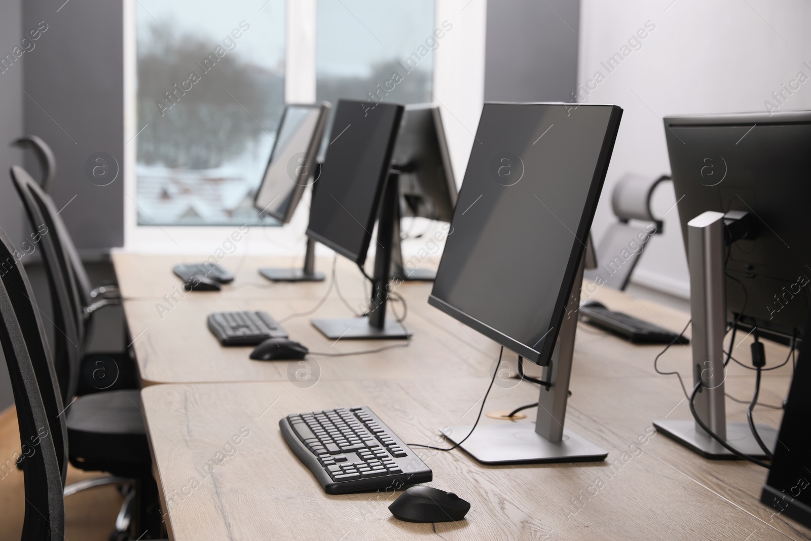 Photo of Many modern computers in open space office