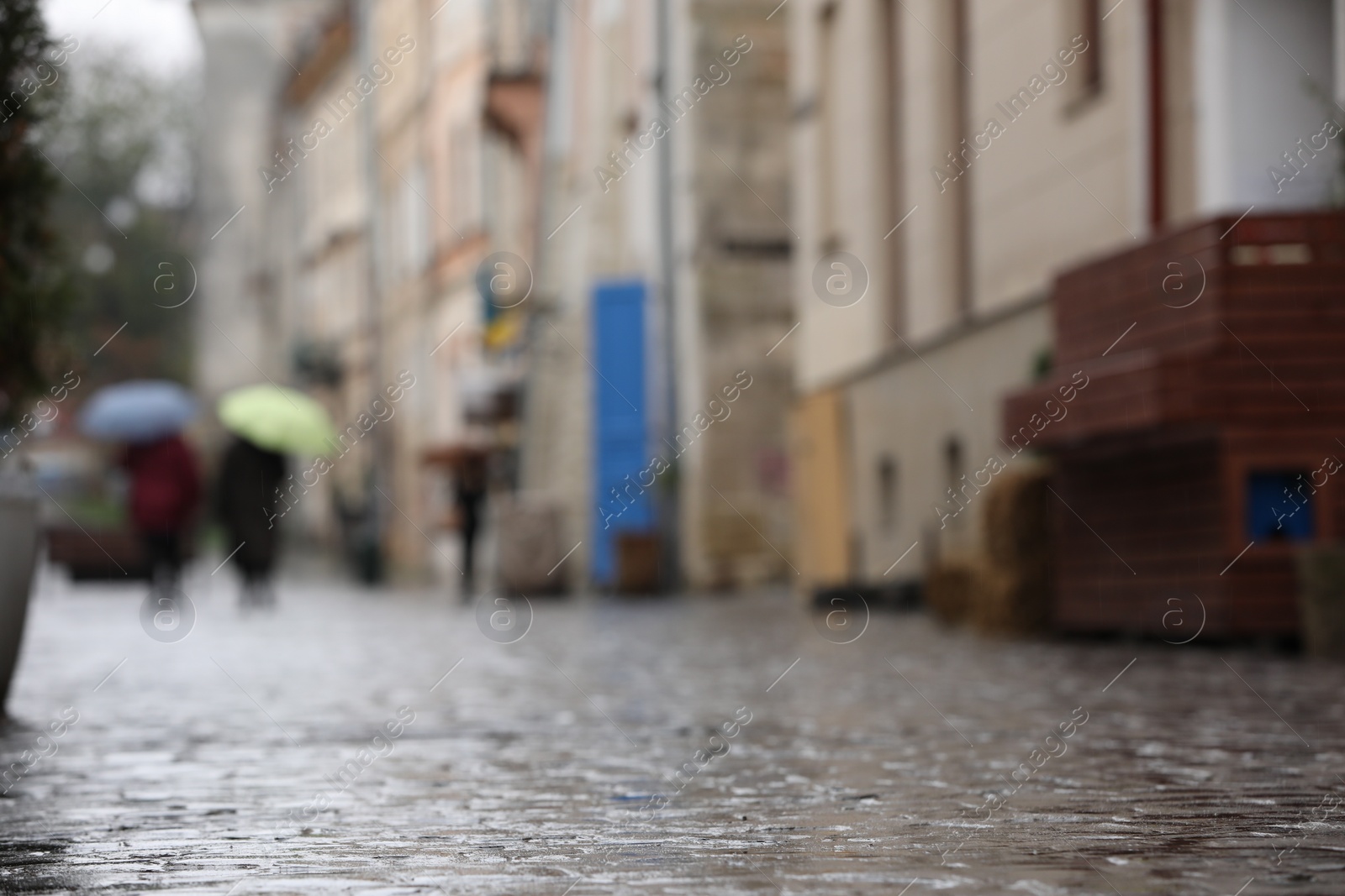 Photo of Wet pavement on city street after rain