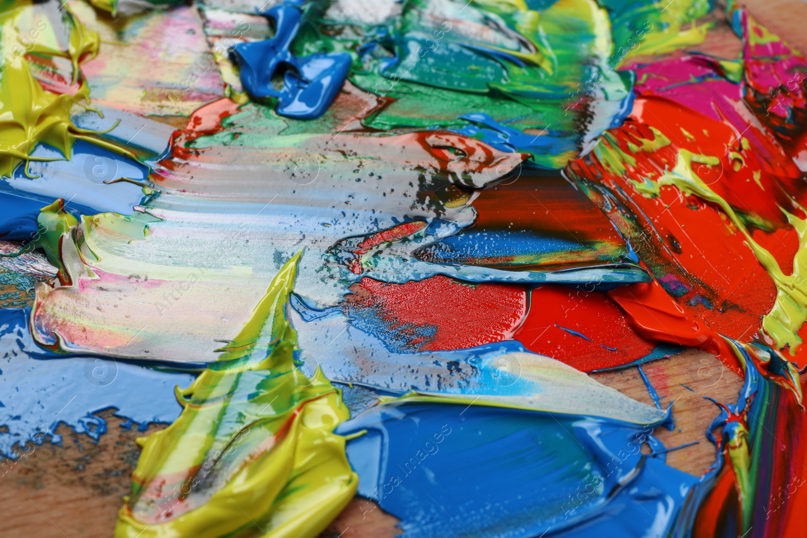 Photo of Abstract colorful acrylic paint as background, closeup view