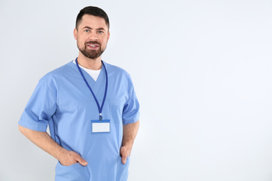 Photo of Portrait of mature doctor on white background