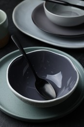 Photo of Setclean tableware on black table