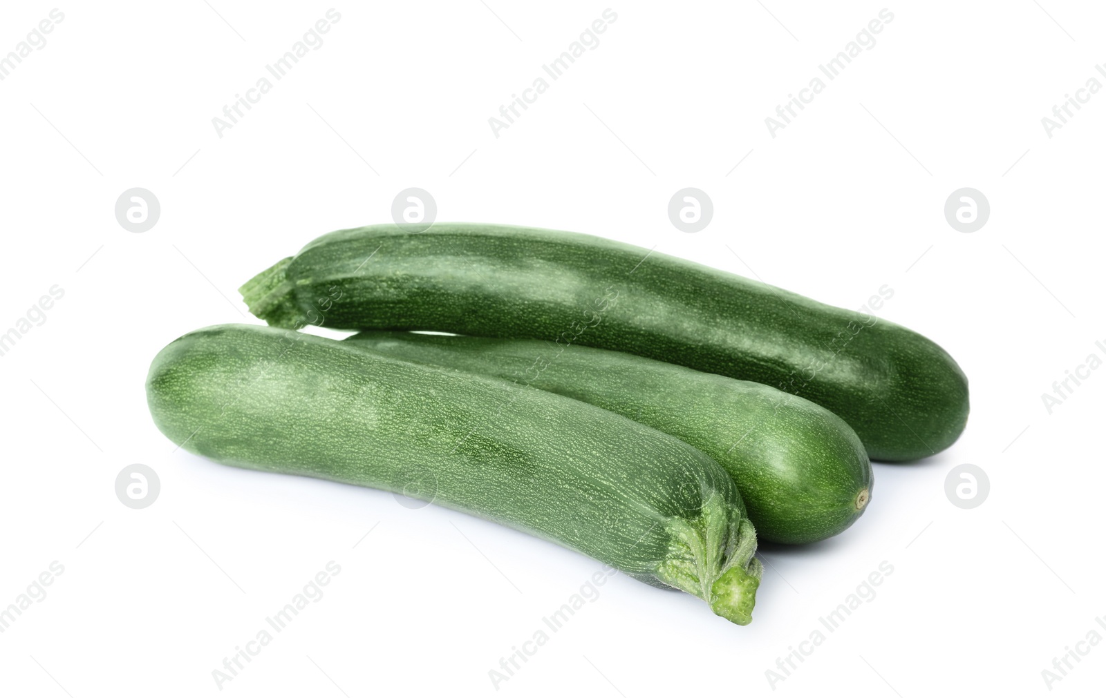 Photo of Raw green ripe zucchinis isolated on white