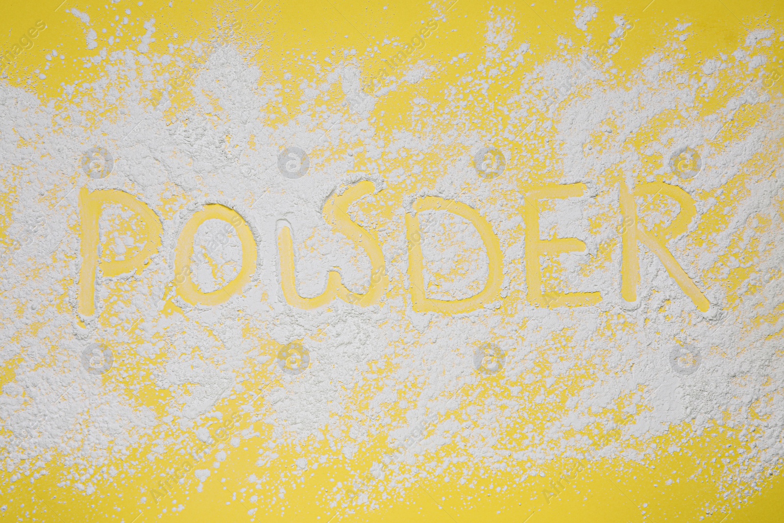Photo of Word Powder made of baby cosmetic product on yellow background, top view