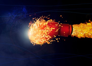 Image of Boxing glove with flame flying on dark background