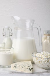 Different fresh dairy products on white wooden table