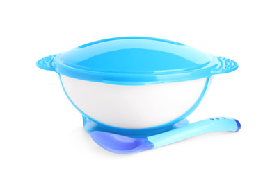 Plastic bowl with lid and spoon isolated on white. Serving baby food