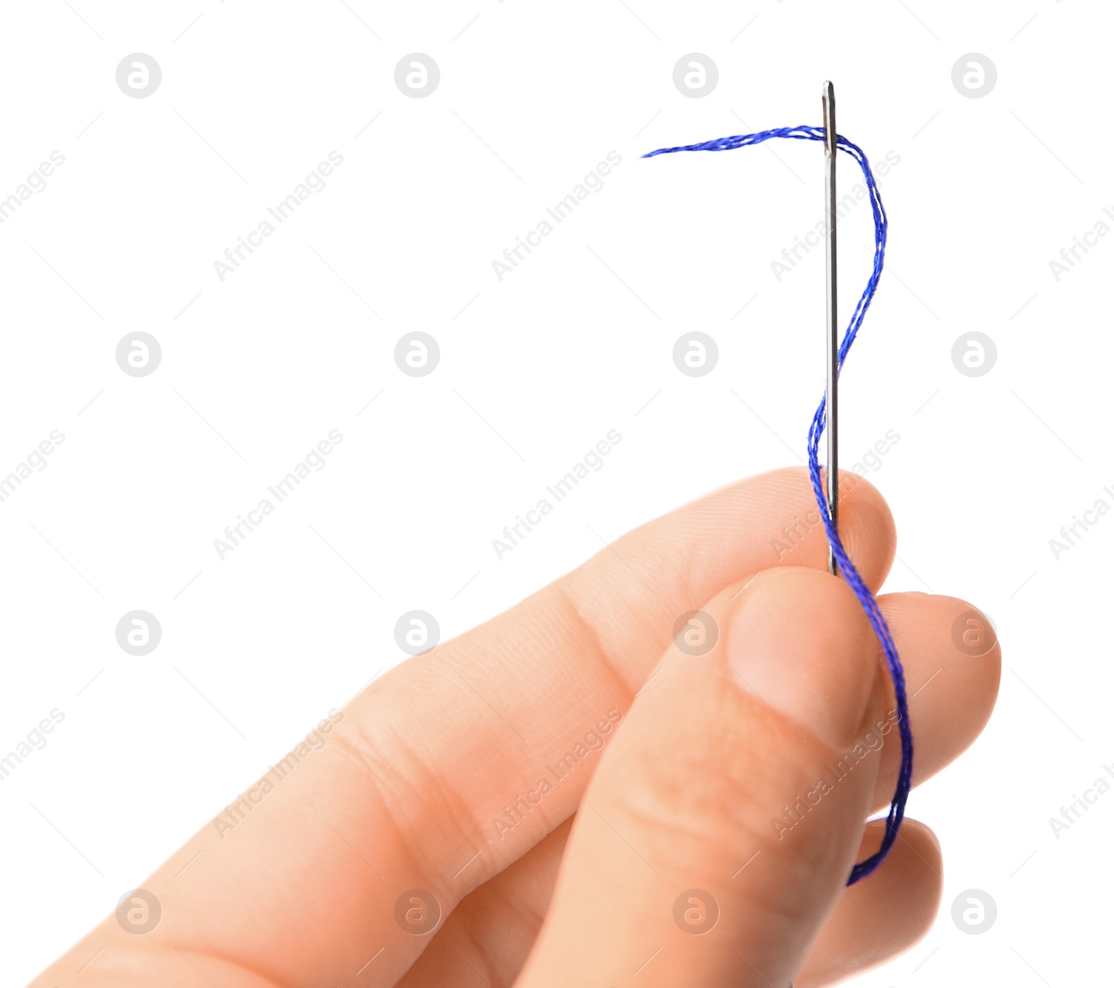 Photo of Woman holding sewing needle with thread on white background, closeup