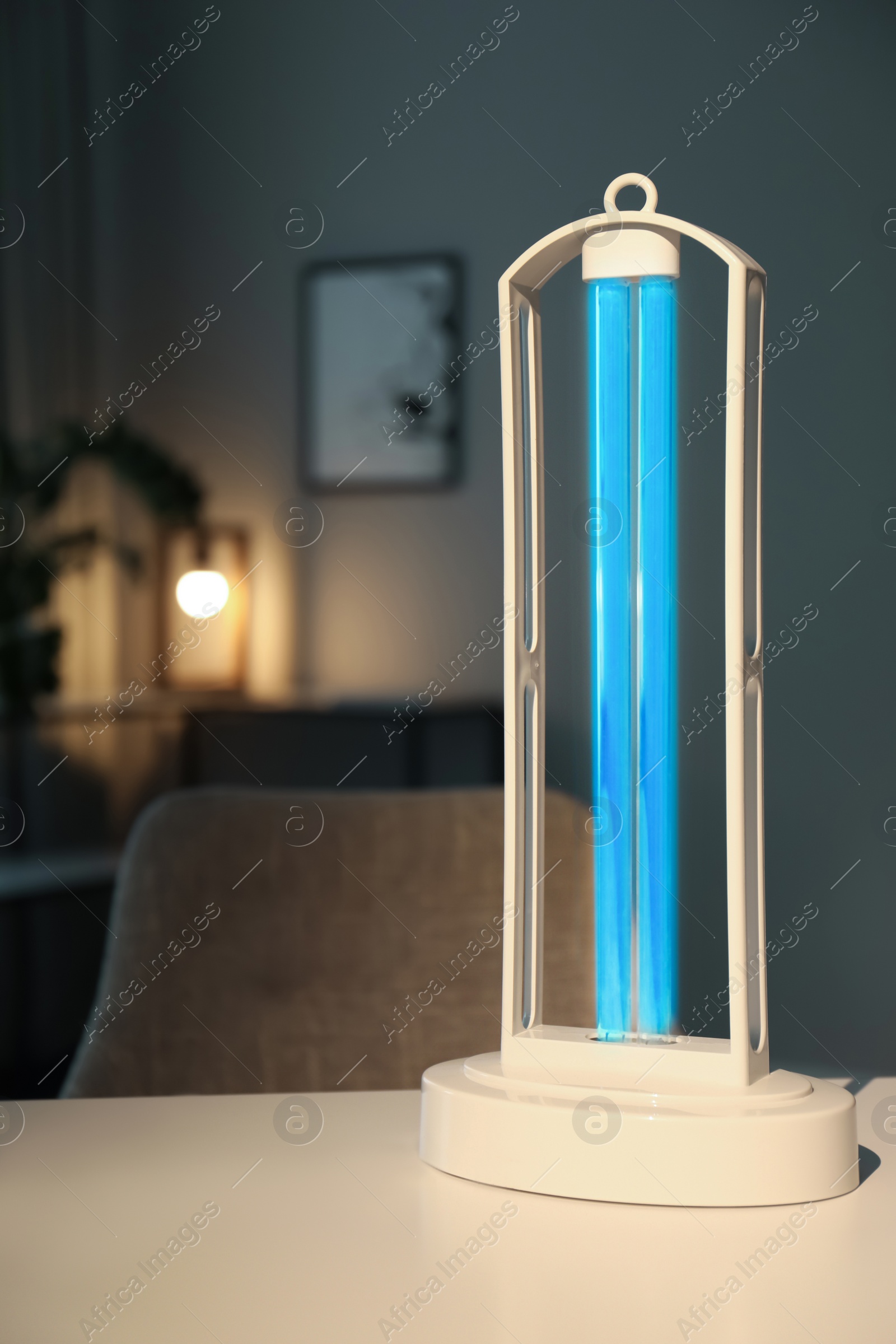 Photo of UV sterilizer lamp on table at home