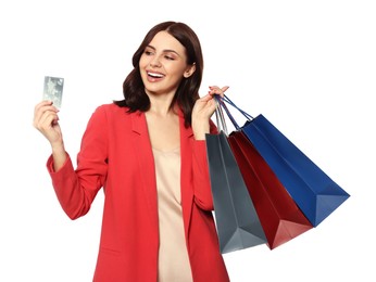 Beautiful young woman with paper shopping bags and credit card on white background