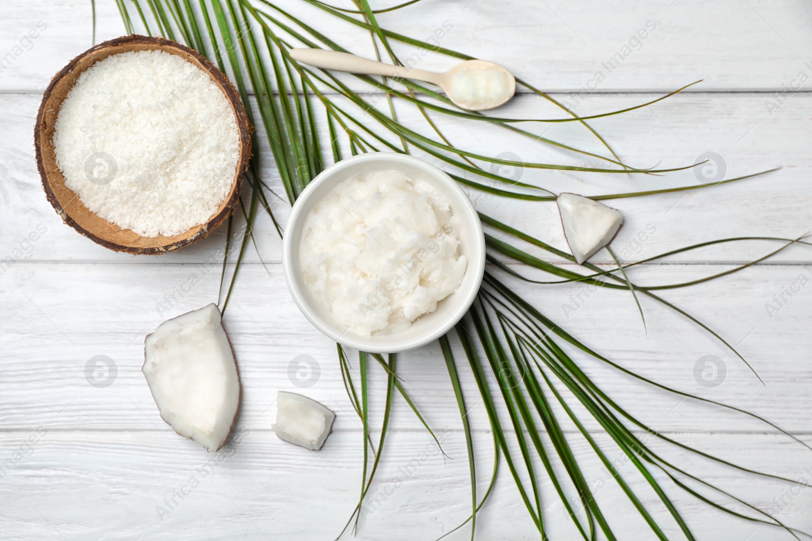 Photo of Composition with coconut oil on wooden table, top view. Healthy cooking