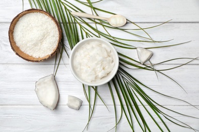 Composition with coconut oil on wooden table, top view. Healthy cooking