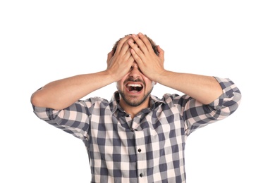 Young man being blinded on white background