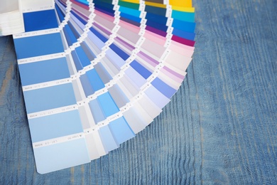 Photo of Color palette samples on wooden background