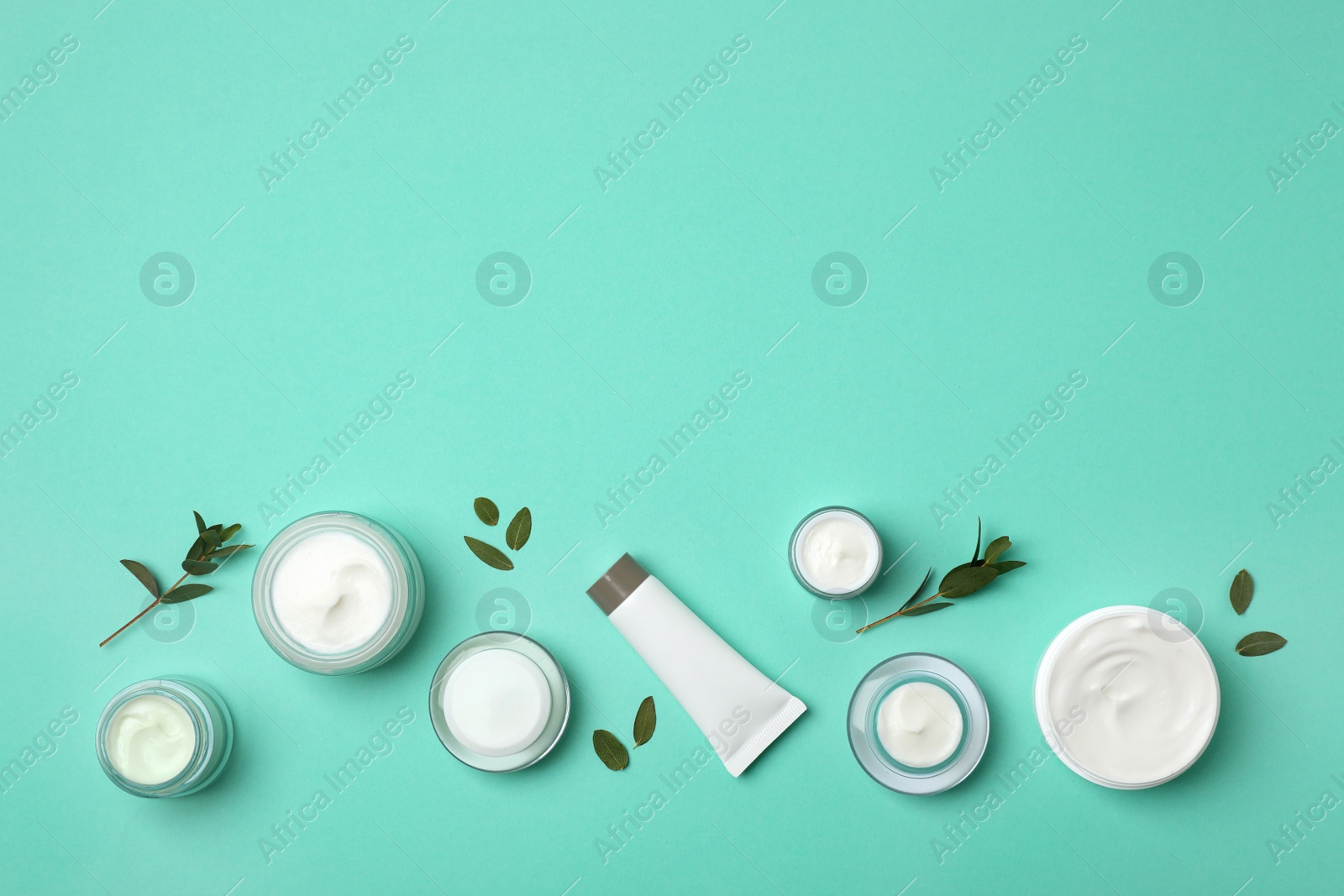 Photo of Flat lay composition with cosmetic products on color background