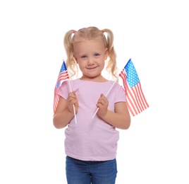 Portrait of cute little girl with American flags on white background