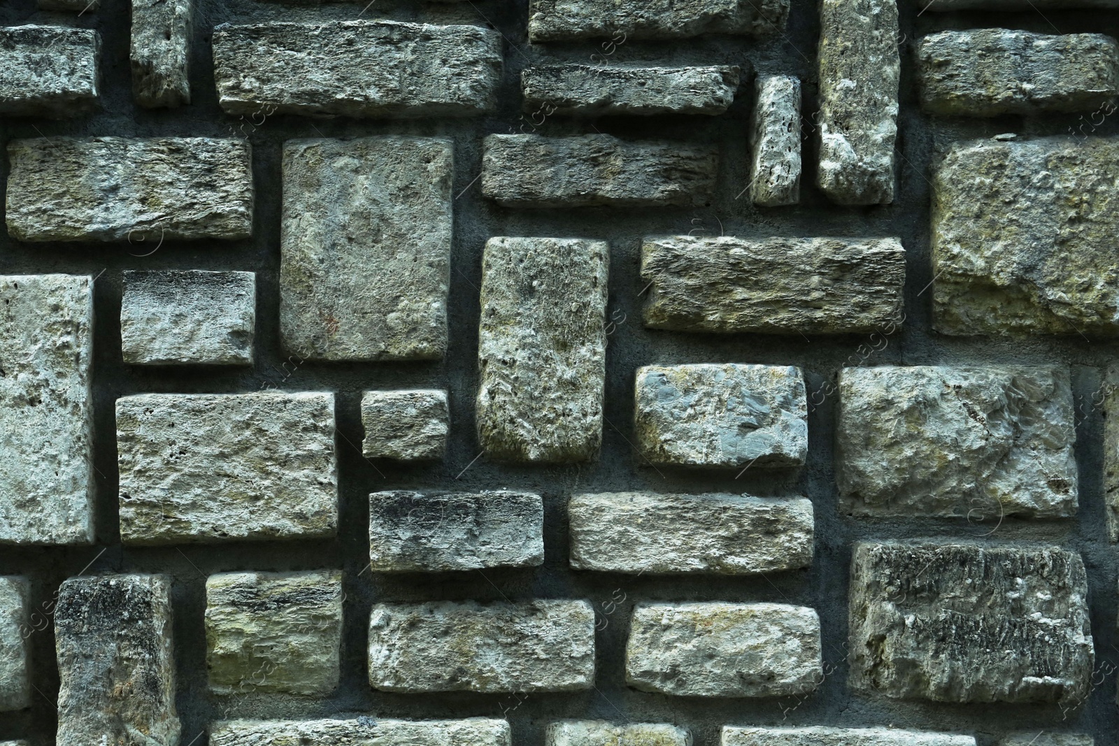 Photo of Texture of grey brick wall as background