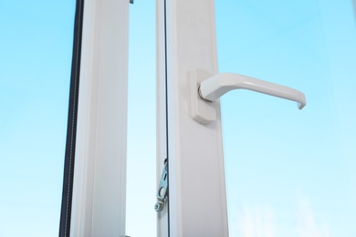 Photo of View of blue sky through modern window indoors