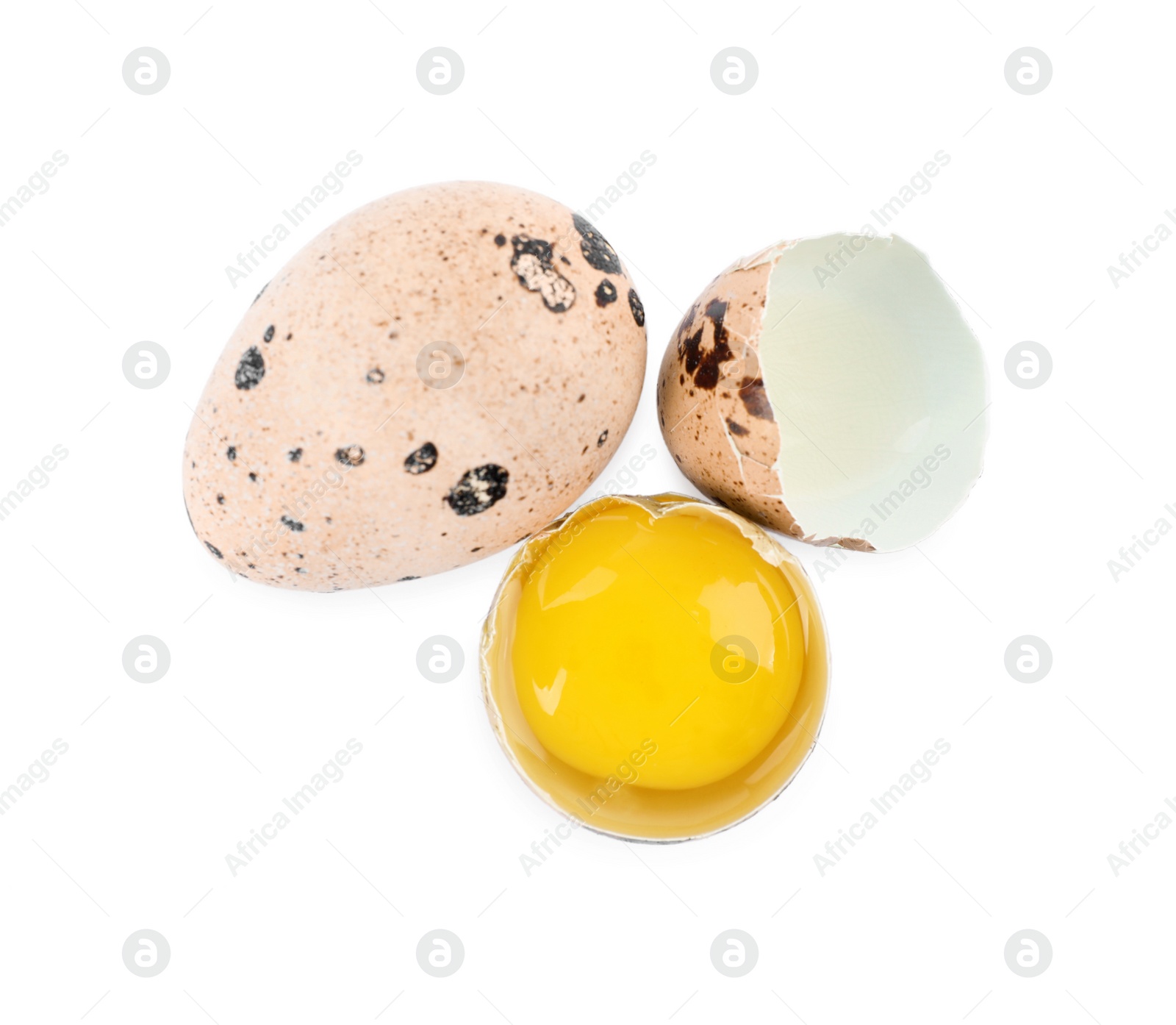 Photo of Whole and cracked quail eggs on white background, top view