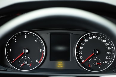 Image of Closeup view of dashboard with warning icon check airbag system in car