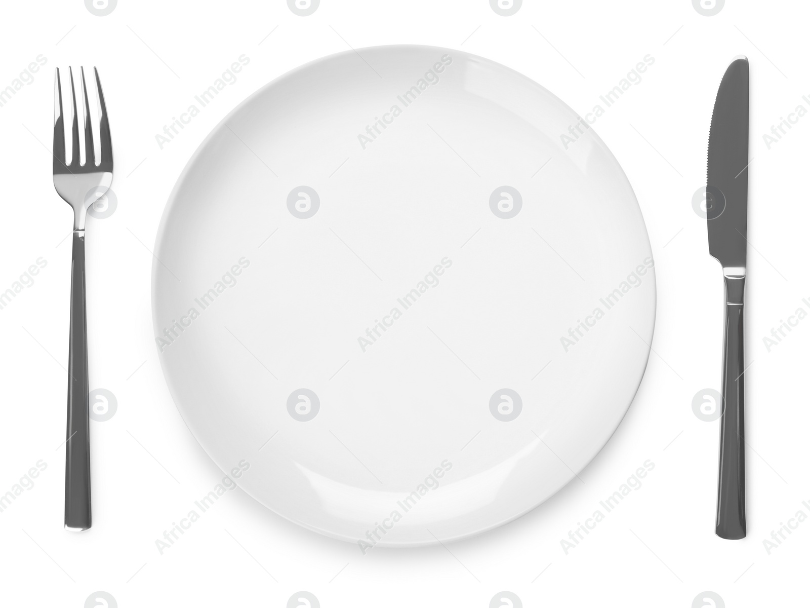 Photo of Plate and cutlery on white background, top view