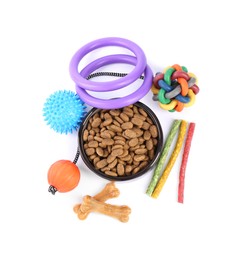 Photo of Dry pet food, toys and other goods isolated on white, top view. Shop items