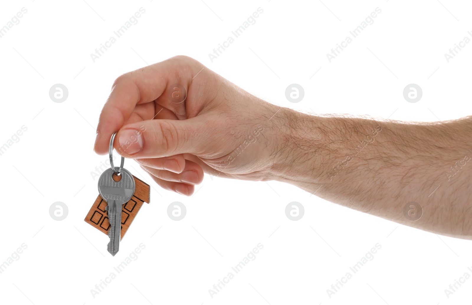 Photo of Real estate agent holding house key with trinket on white background, closeup