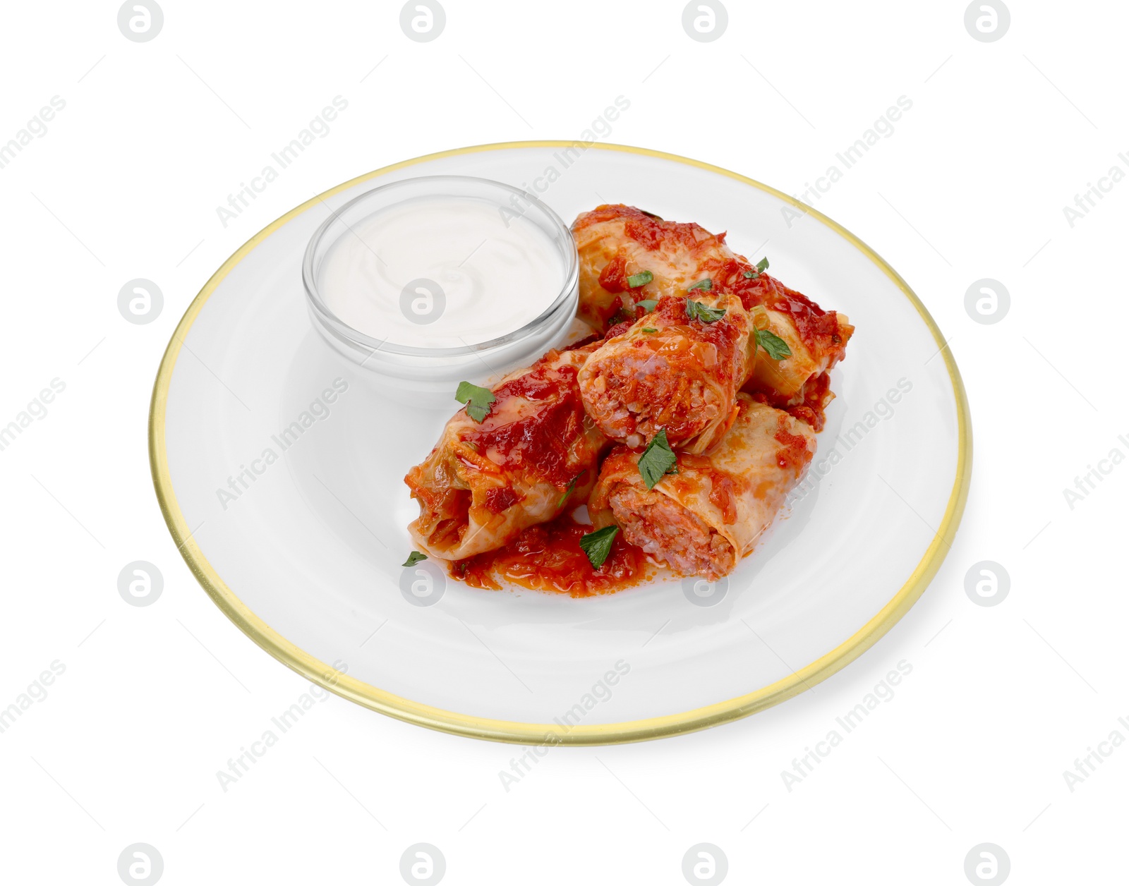 Photo of Plate of delicious stuffed cabbage rolls with sour cream isolated on white