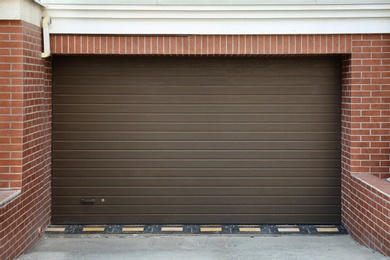 Closed roller shutter door of modern garage