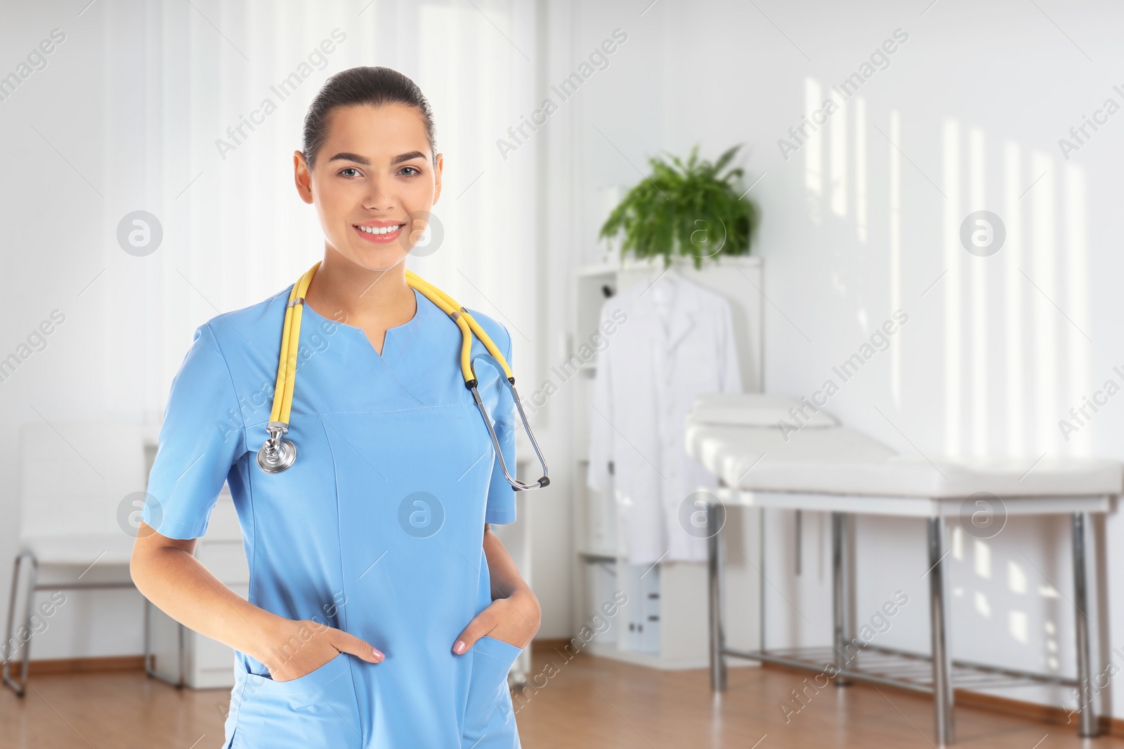 Image of Nurse with stethoscope in uniform at hospital