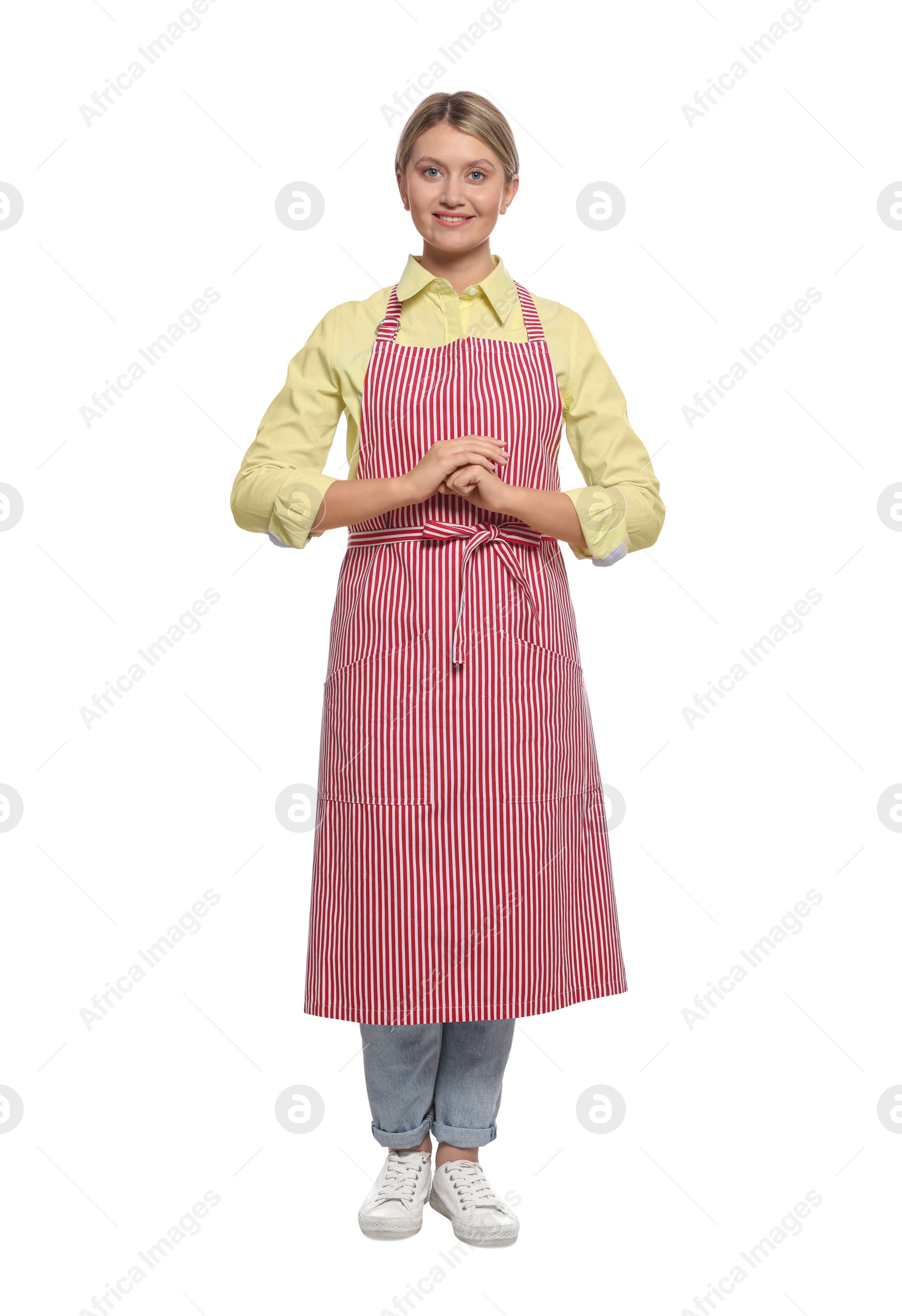 Photo of Beautiful young woman in clean striped apron on white background