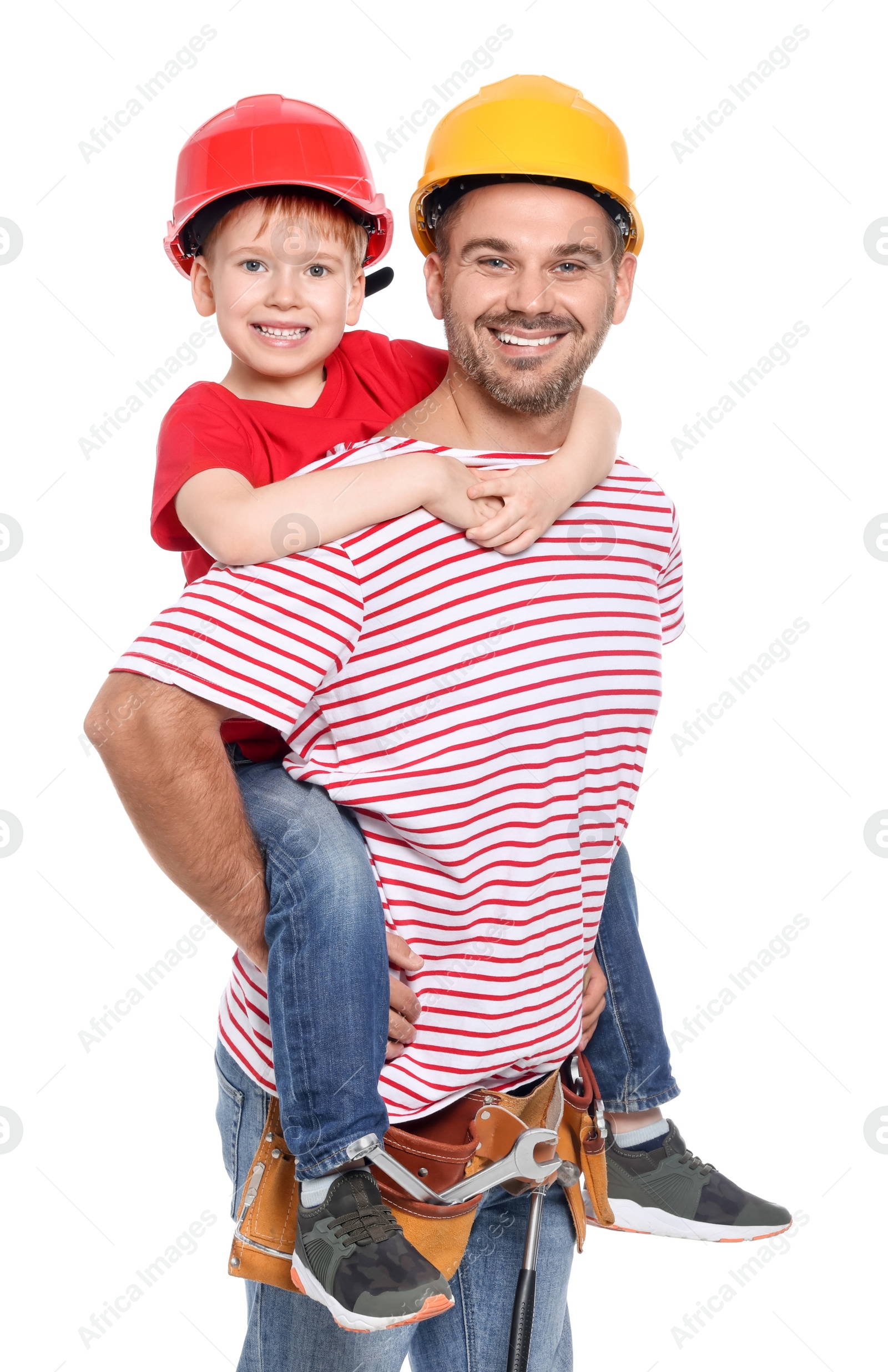 Photo of Father and son in hard hats having fun on white background