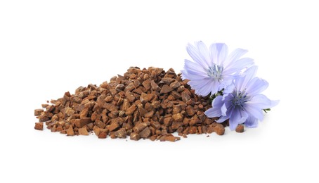 Photo of Pile of chicory granules and flowers on white background