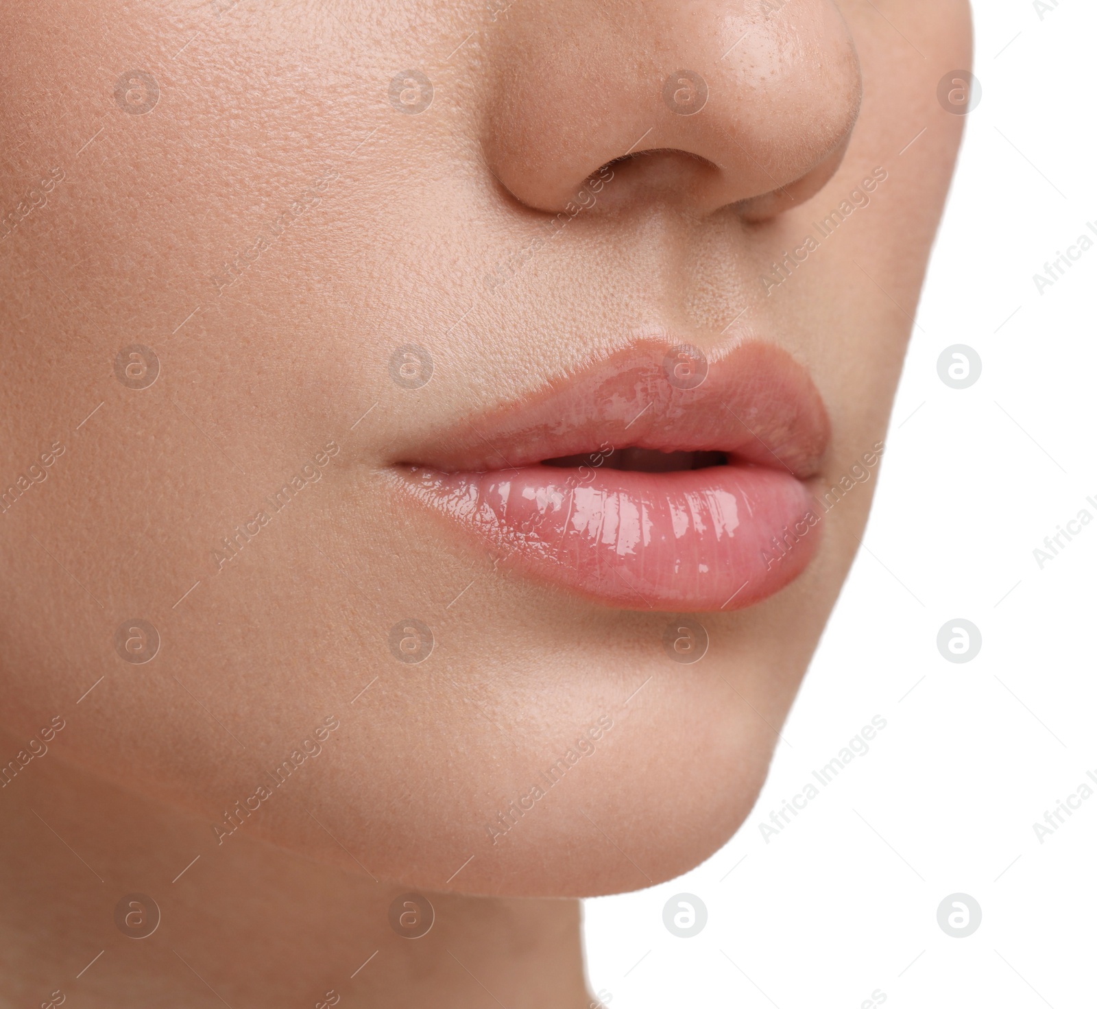 Photo of Woman wearing beautiful lip gloss on white background, closeup