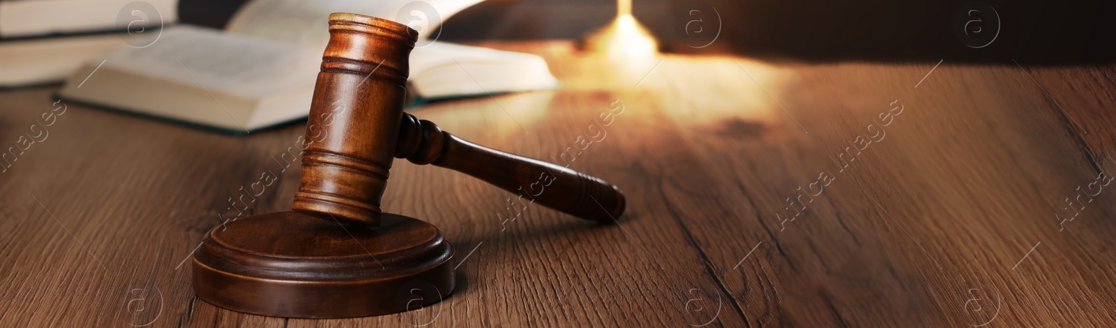 Image of Law concept. Gavel and sound block on wooden table. Banner design with space for text