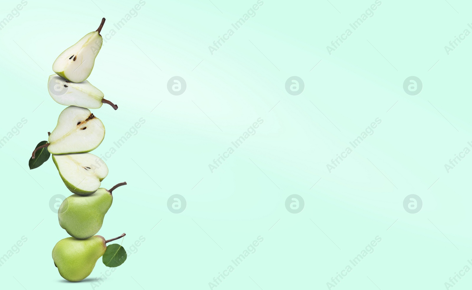 Image of Cut and whole fresh ripe pears on light aquamarine background, space for text