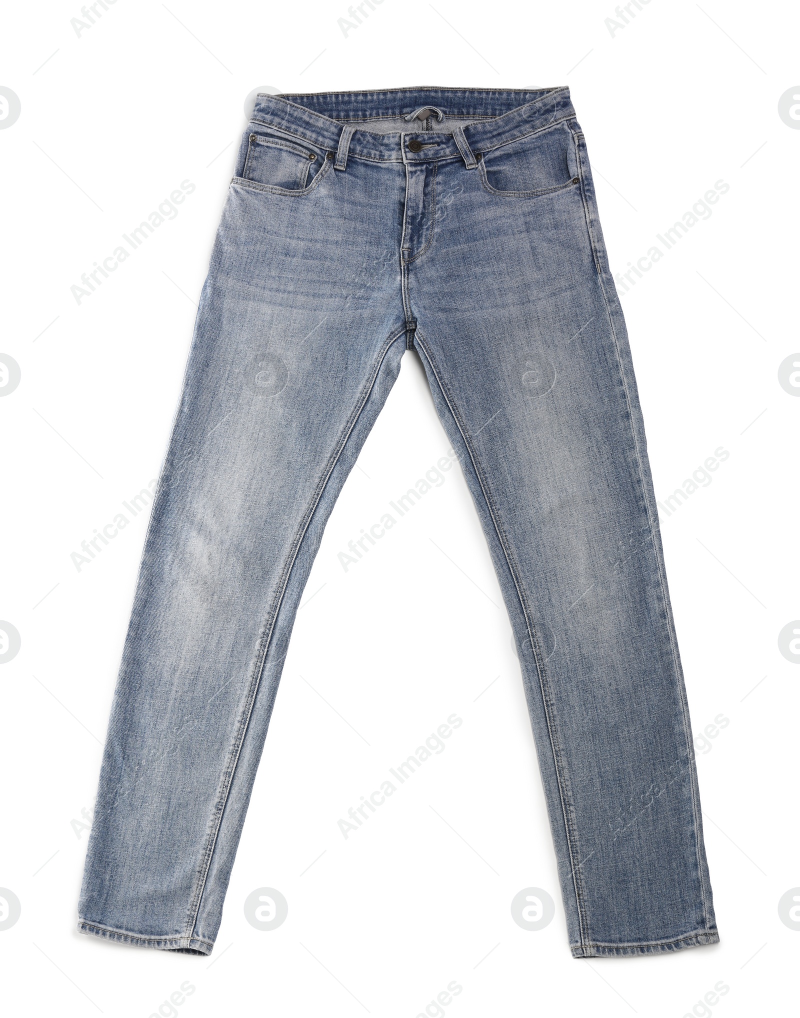 Photo of Stylish light blue jeans isolated on white, top view