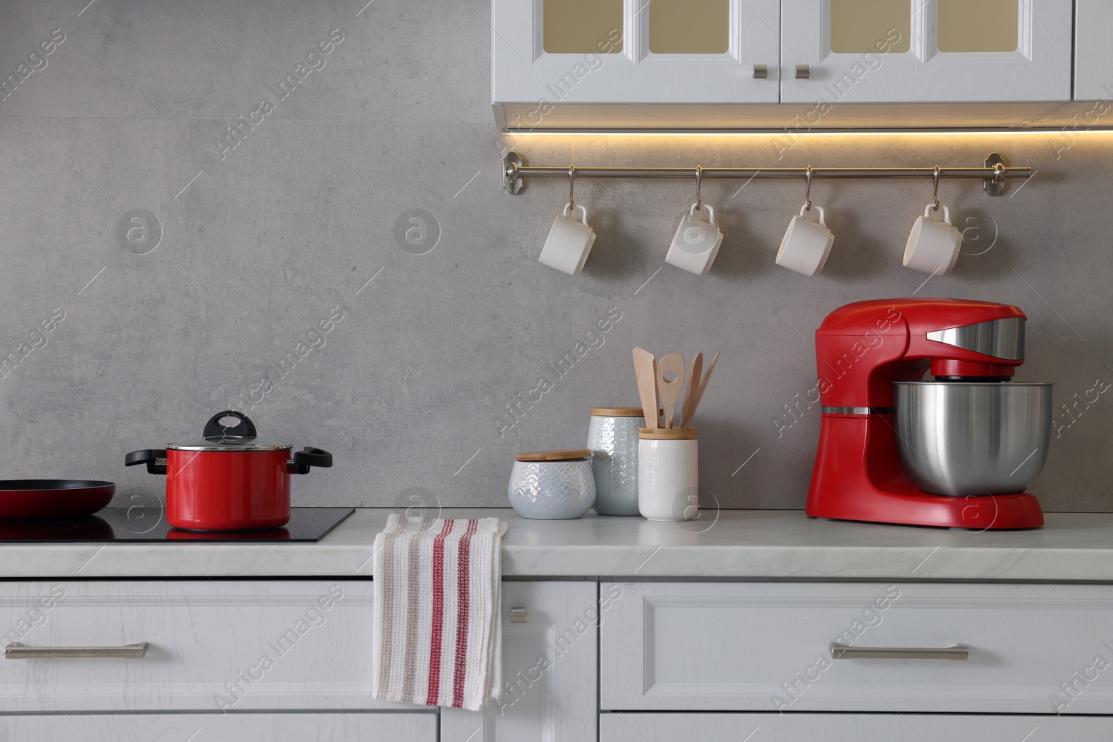 Photo of Set of different utensils on countertop in kitchen