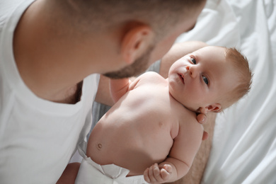 Father with his newborn son, closeup view