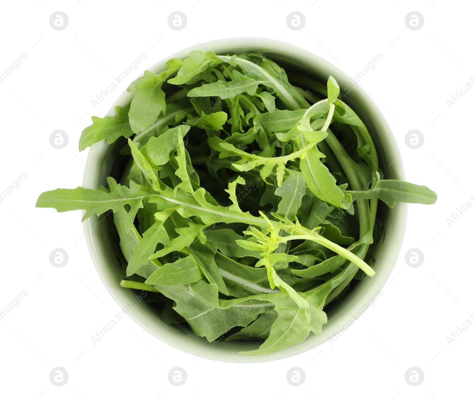 Photo of Delicious fresh arugula in bowl isolated on white, top view