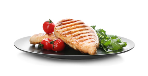 Photo of Tasty grilled chicken fillets with tomatoes and arugula isolated on white