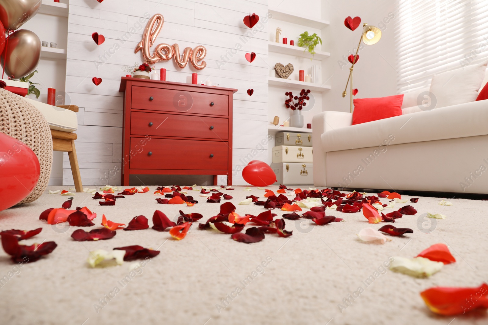 Photo of Cozy living room decorated for Valentine's Day, ground level view