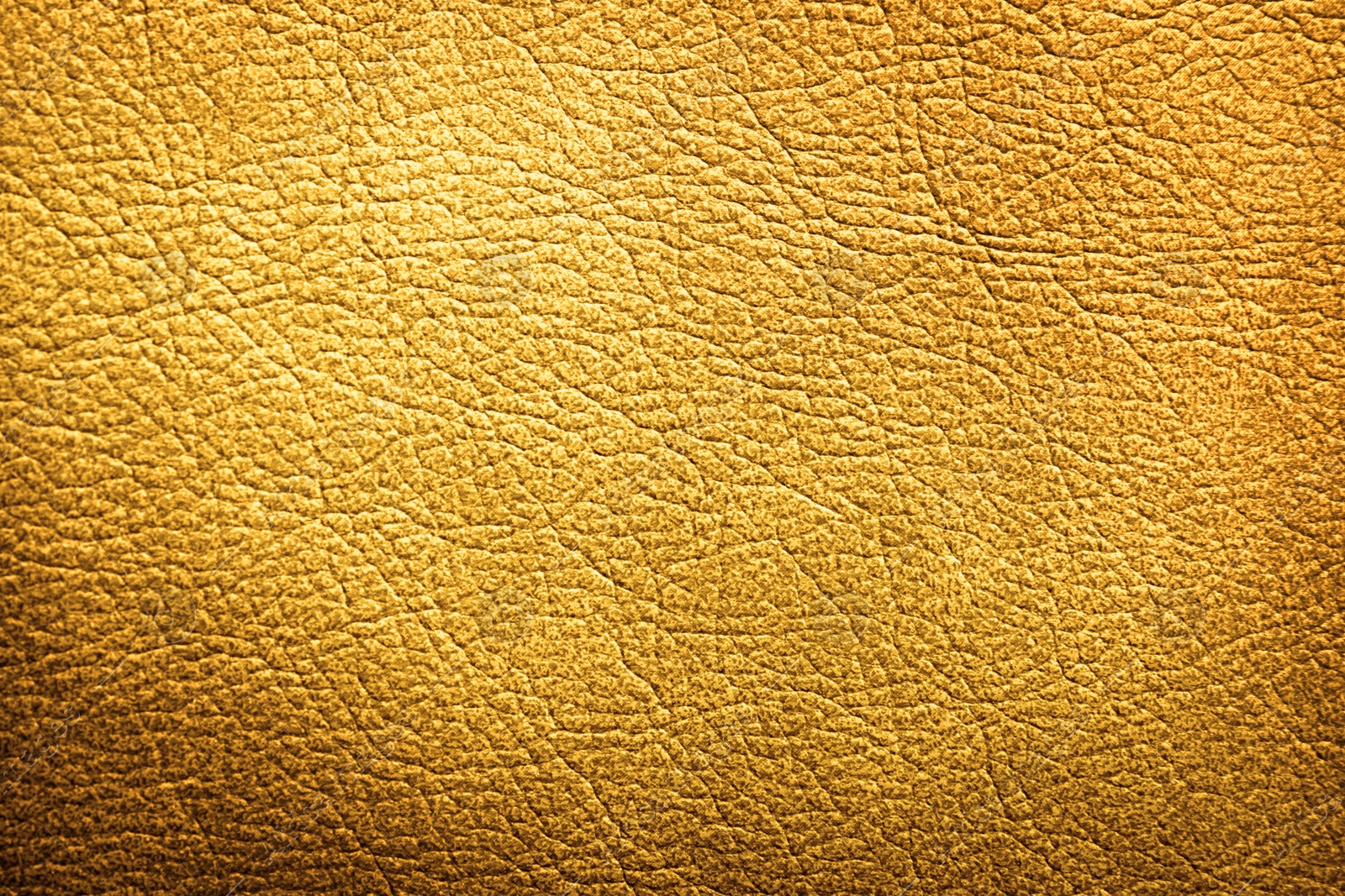 Image of Golden textured surface as background, closeup view