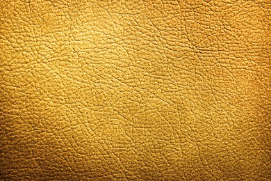 Image of Golden textured surface as background, closeup view