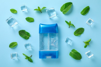 Flat lay composition with natural male deodorant on light blue background