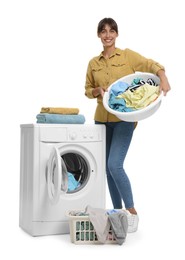 Photo of Beautiful woman with laundry near washing machine on white background