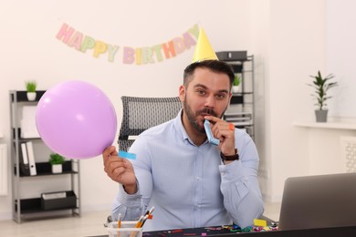 Photo of Man having fun during office party at workplace